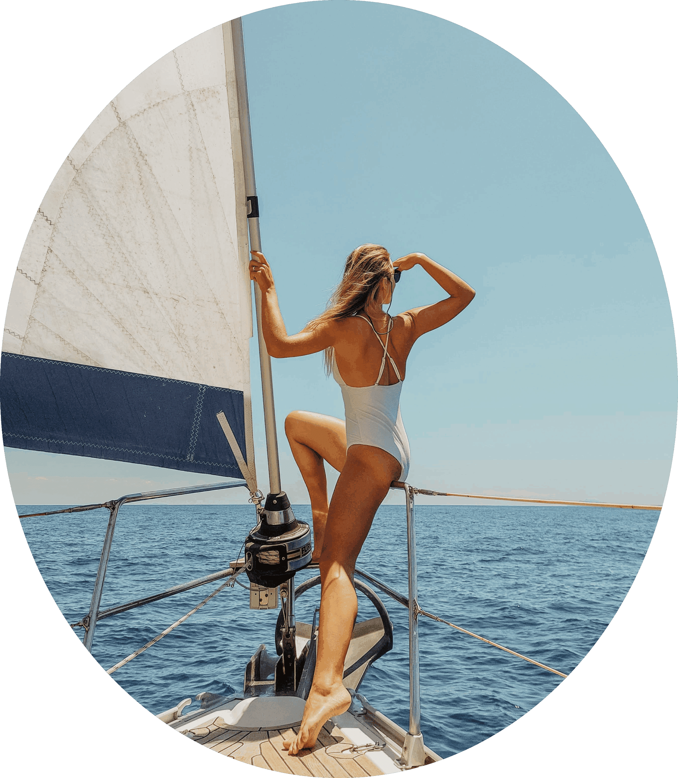 Person at the bow of a sailboat. Looking ahead towards new horizons